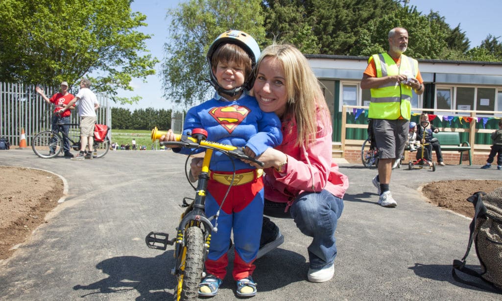 Young boy and mother with bike