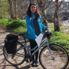 Young lady borrowing a loan bike