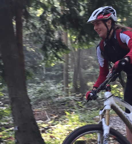 Female mountain bike rider cycling in Leigh Wood Bristol