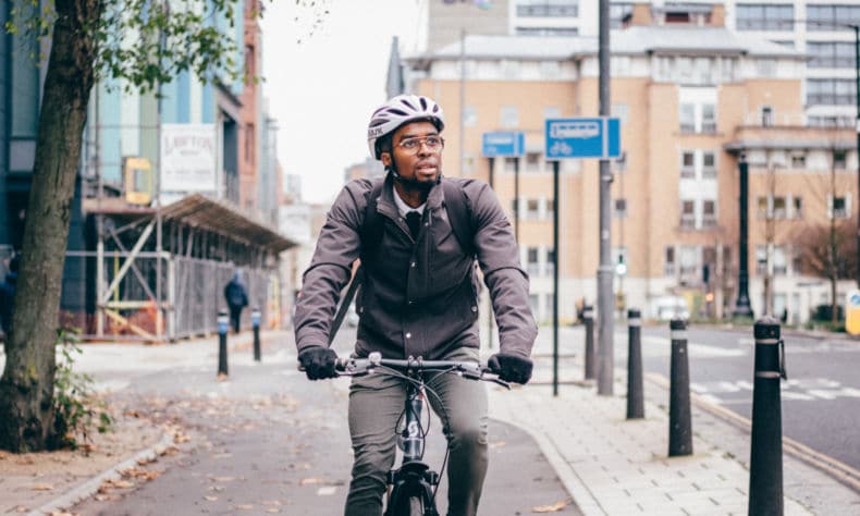 Man cycling in Bristol on segregated cycle way