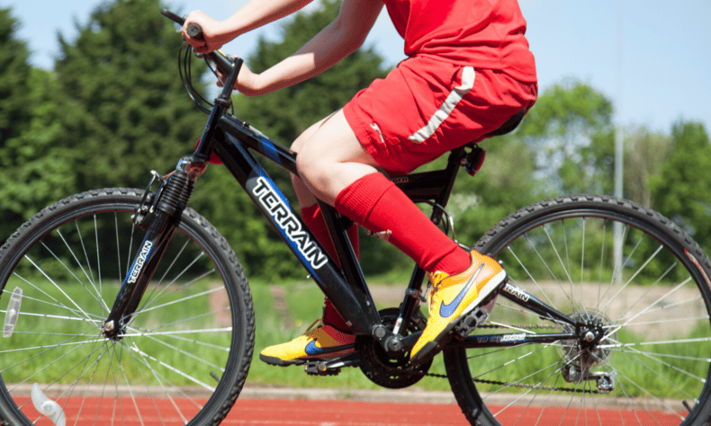 Close up of young boy cycling at Bristol Family Cycling Centre
