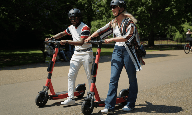 Photo of man and women using e-scooter