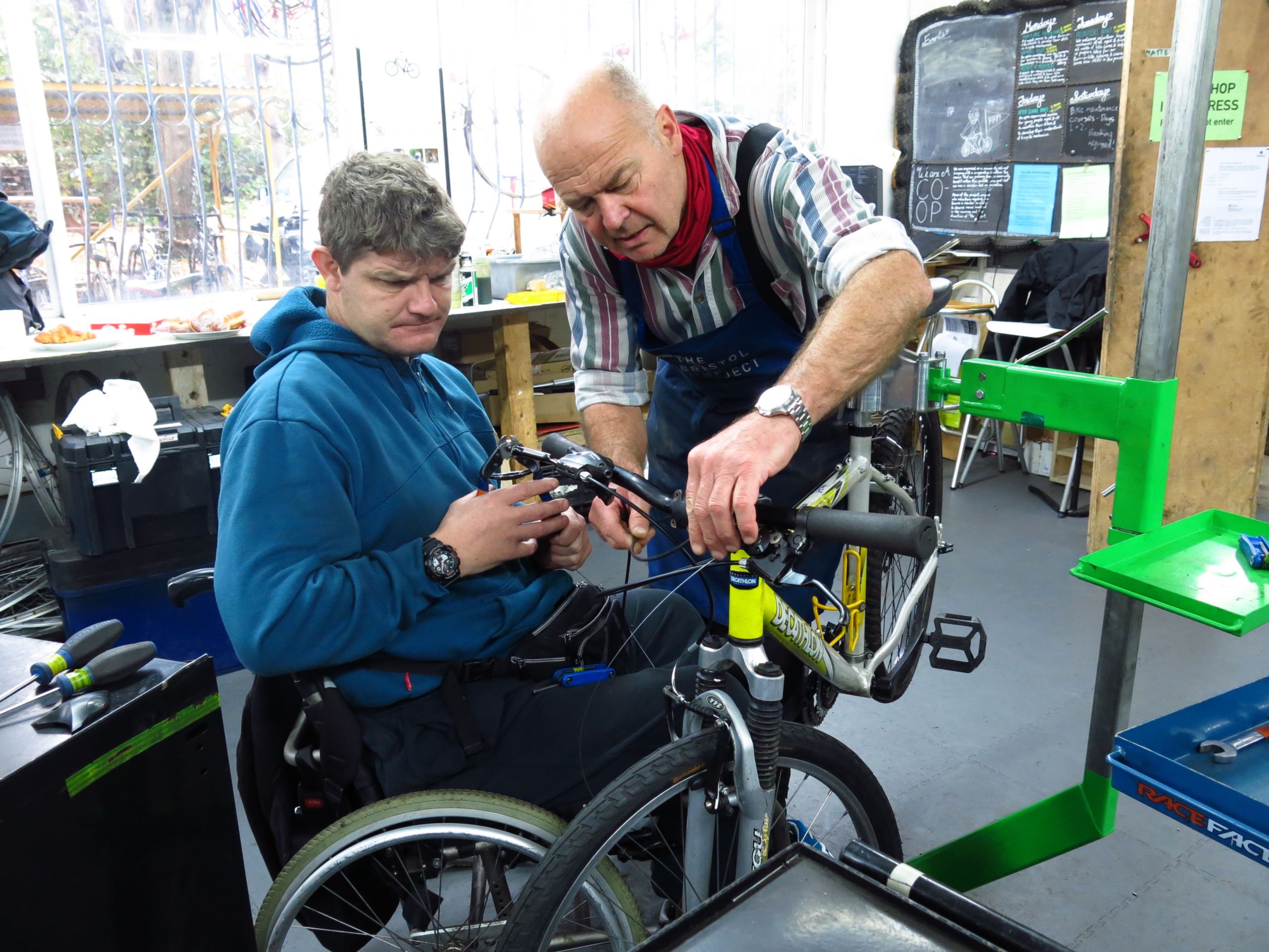 Photo of man fixing a bike